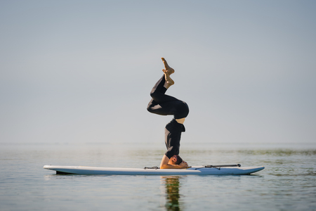 Flexible man on boardの写真素材