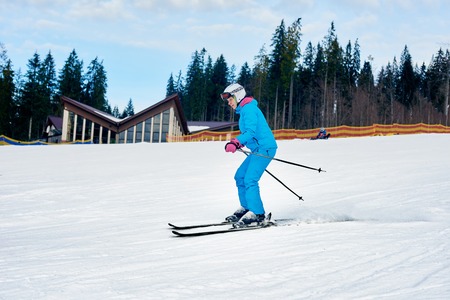 Sporty woman skiingの写真素材