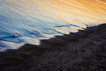 Tropical beach on sunsetの写真素材