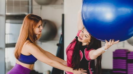 Family exercising with fitballの写真素材