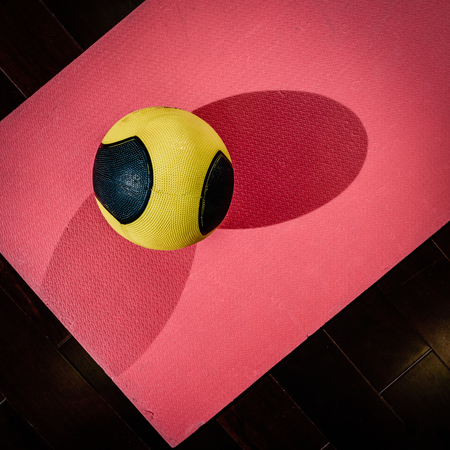 Ball on yoga matの写真素材