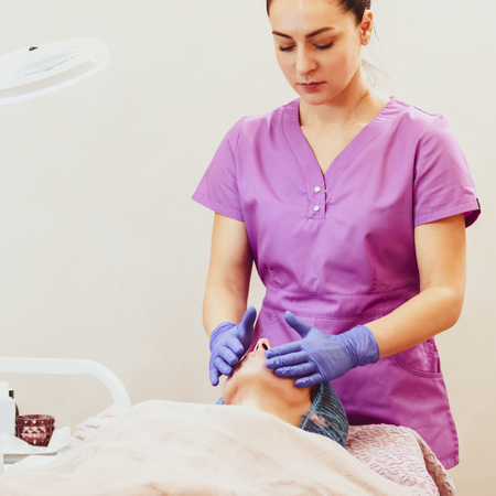 Doing facial massageの写真素材