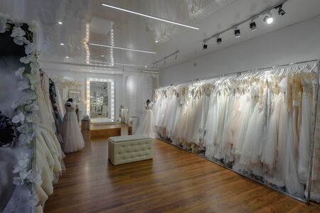 Dnepr, Ukraine- October 18, 2018: Beautiful stylish wedding dresses hanging in modern bridal salonのeditorial素材