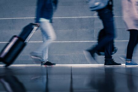 Closeup of busy people at rush hour walking on city streetの写真素材