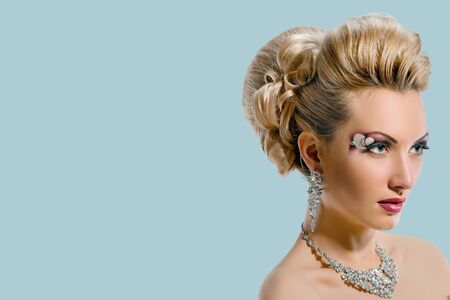 Fashion Beauty. Bride. Hairstyle. on blue color backgroundの写真素材
