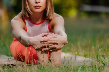 yoga woman stretching before training in parkの写真素材