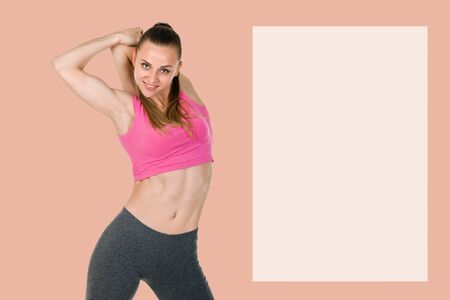 Young woman in sportswear warming up on color background with copyspace for text or advertising