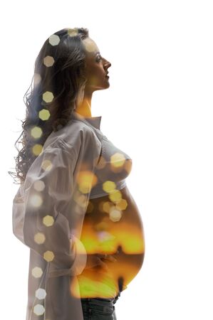 slim pregnant woman silhouette on white background, double multiple exposure effect,combined imagesの写真素材