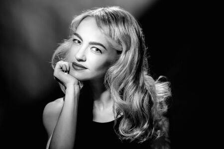 Monochrome vintage portrait of young glamorous blonde womanの写真素材