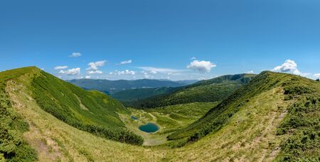 Panoramic view of Carpathian mountains on summer sunny dayの写真素材