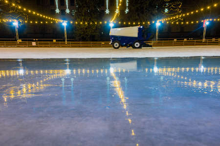 Dnepr, Ukraine- January 07, 2020: Closeup of resurfacing machine preparing ice rink for skating on winter eveningのeditorial素材