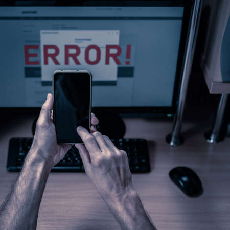 hands of chatting man with bank technical support, text "Error" on computer screenの写真素材