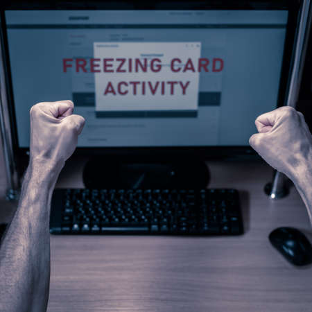 fists of Worried angry man paying online on computer and having problem with credit card