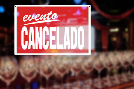 EVENT CANCELLED sign saying in spanish, Empty restaurant without people, financial losses of business, quarantine concept, precautions during a pandemic, fighting covid virus, social distancingの写真素材