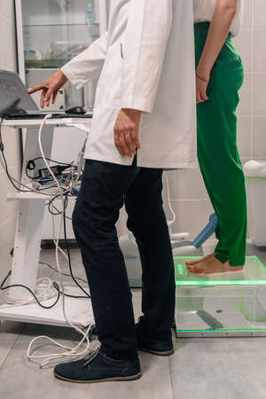 Dnepr, Ukraine- July 17, 2020: Young woman doing bone densitometry test to detect osteopenia or osteoporosisのeditorial素材