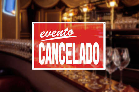 EVENT CANCELLED sign saying in spanish, Closure of all restaurants, bars and cafes due to coronavirus outbreak, precautions during a pandemic, fighting covid virus, social distancingの写真素材