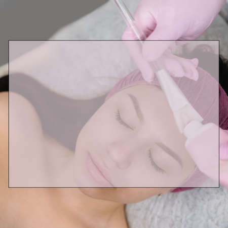 Cosmetologist applaying peeling mask on female face in beauty salon, with field for ad text