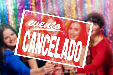 EVENT CANCELLED sign saying in spanish, Sign Party cancelled warning to stay home during Christmas celebration, precautions during a pandemic, fighting covid virus, social distancingの写真素材