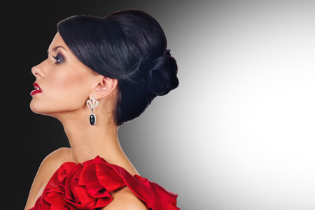 Profile photo of vogue style fashion woman in jewelry, background with a gradient from dark to light...