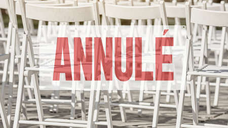 French lettering CANCELED. Empty seats and attention sign event cancelled due to coronavirus quarantineの写真素材