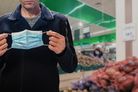 Use protective face mask in public places during outbreakの写真素材