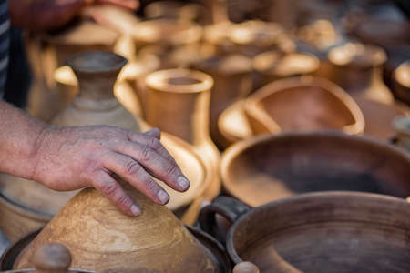Stall with handmade ceramic souvenir bowls and dishes for sale