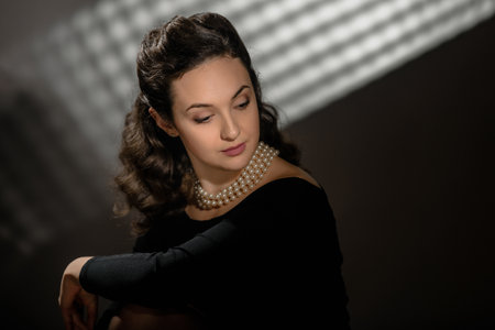 Portrait of young beautiful elegant woman wearing pearlsの写真素材