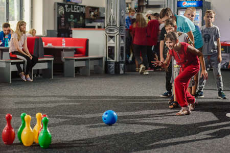 Dnepr, Ukraine- September 06, 2020: Group of excited children playing bowling with colorful skittlesのeditorial素材