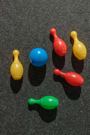 Top view of colorful skittles lying on playground floorの写真素材