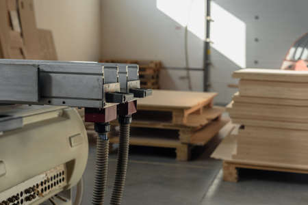 Closeup photo of automatic woodworking machine to produce furniture