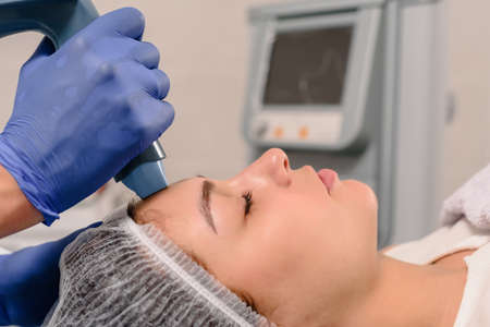 Woman client doing SMAS lifting to bring face more youthful look