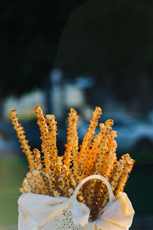 Traditional baked breadsticks in basket also known as grissini, Breadsticks , grissino or dipping sticks, are generally pencil-sized sticks of crispの写真素材