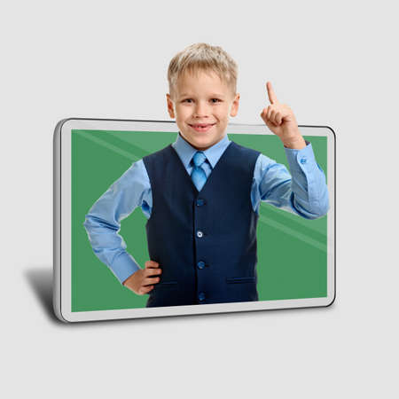 Smart young boy using new technology at school for online study concept