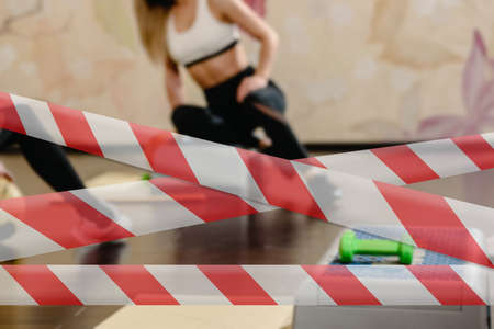 barrier tapes for group workout. Closeup of healthy sporty woman training with step platformの写真素材