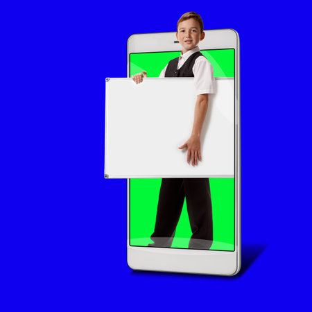 Using modern mobile gadgets for distance study and remote education concept, blue chroma key on the background and green in the smart deviceの写真素材