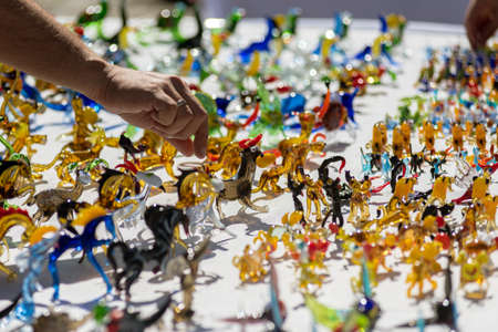 Blowing glass into various beautiful colorful animal shapesの写真素材