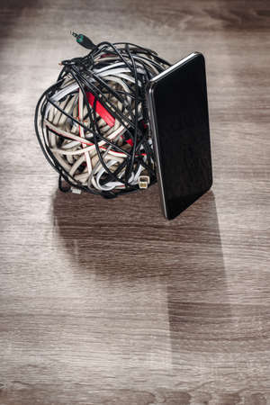 Coil of electronic cables from modern smartphone, future wireless technology