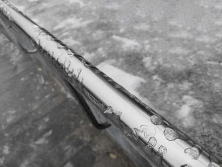 Concept of danger and slippery in winter city after freeze and snowの写真素材