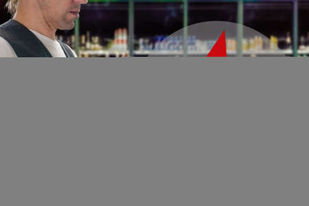 Closeup of young man holding bill to check the price in supermarket, arrow in the form of a...