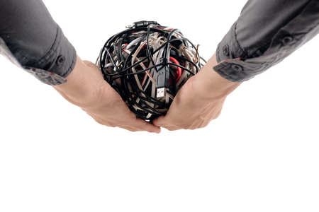 Concept of the globe sphere as interlaced electric wires in male handsの写真素材