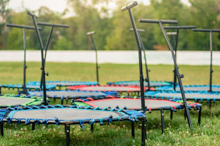 Set of trampolines on green grass field for outdoor fitness workoutの写真素材