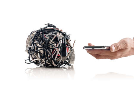 Modern mobile wireless technology solving problem of tangle cablesの写真素材