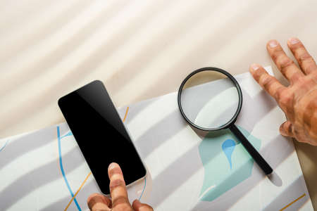 Male spy agent looking for evidences, light through the jalousieの写真素材