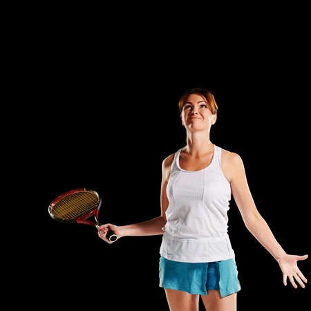 Portrait of young fit healthy woman winner of tennis matchの写真素材