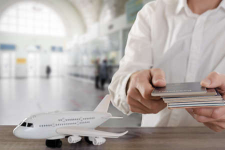 Closeup of man tourist handing over his passport for boarding control