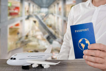 Closeup photo of man giving his passport at the customs office