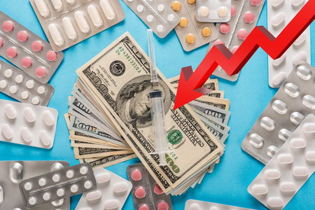 Red arrow showing rising cost of pills and healthcare servicesの写真素材