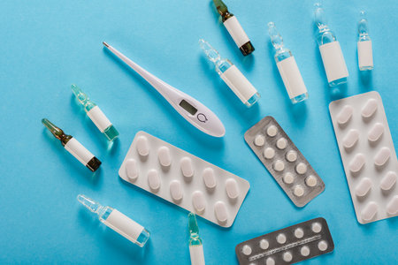 Virus prevention medical kit: electronic thermometer, pills and ampoules with vaccineの写真素材