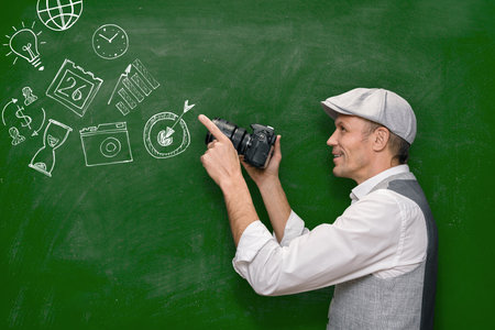 Male photographer showing how to making photo on photographing lessonの写真素材