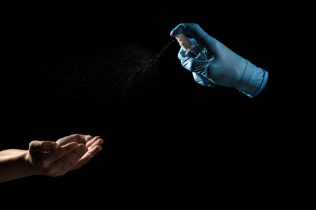 Process of sanitizing hands for virus prevention and staying healthyの写真素材